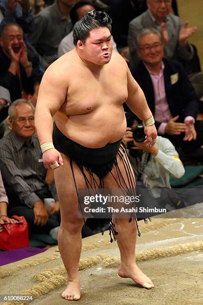 Ozeki Goeido reacts after winning against Mongolian yokozuna Kakuryu during day twelve of the Grand Sumo Autumn Tournament at Ryogoku Kokugikan on...