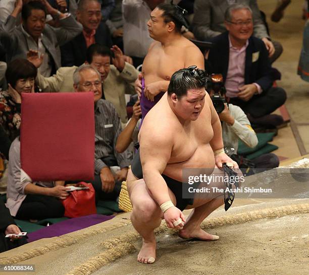 Ozeki Goeido reacts after winning against Mongolian yokozuna Kakuryu during day twelve of the Grand Sumo Autumn Tournament at Ryogoku Kokugikan on...