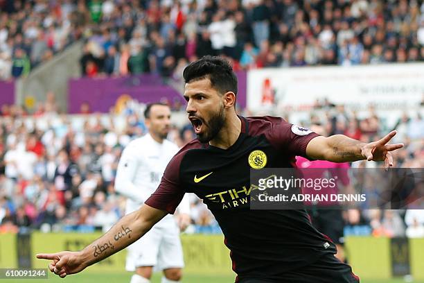 Manchester City's Argentinian striker Sergio Aguero celebrates scoring the opening goal during the English Premier League football match between...