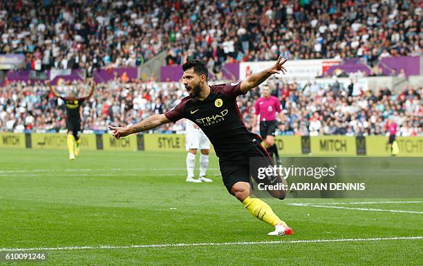 Manchester City's Argentinian striker Sergio Aguero celebrates scoring the opening goal during the English Premier League football match between...