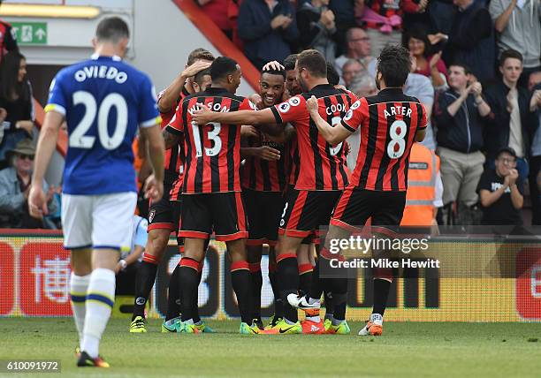 Junior Stanislas of AFC Bournemouth celebrates scoring his sides first goal with his team mates during the Premier League match between AFC...