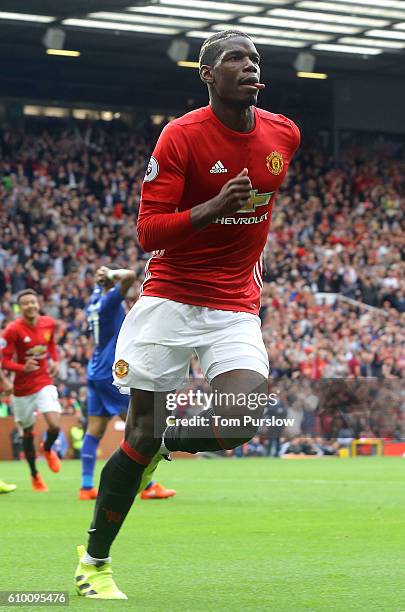 Paul Pogba of Manchester United celebrates scoring their fourth goal during the Premier League match between Manchester United and Leicester City at...