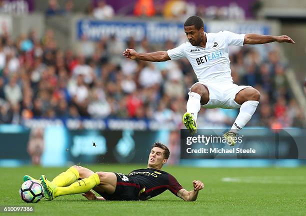 Wayne Routledge of Swansea City is fouled by John Stones of Manchester City during the Premier League match between Swansea City and Manchester City...