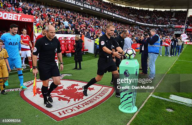Referee Graham Scott collects the match ball prior to the Premier League match between Middlesbrough and Tottenham Hotspur at the Riverside Stadium...