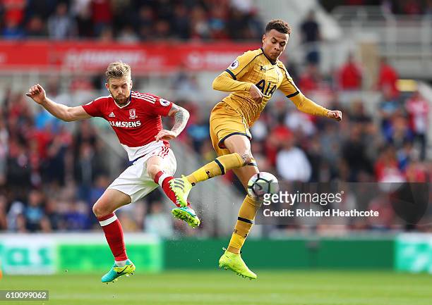 Adam Clayton of Middlesbrough and Dele Alli of Tottenham Hotspur battle for possession during the Premier League match between Middlesbrough and...