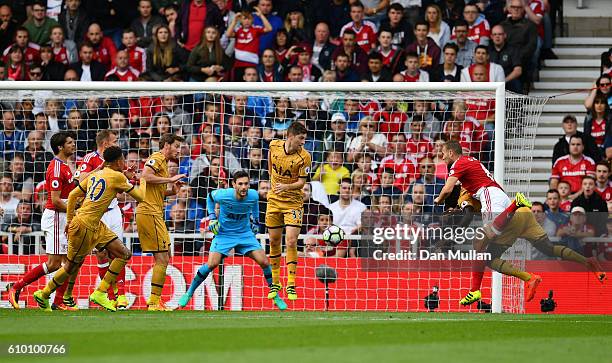 Ben Gibson of Middlesbrough scores his sides first goal during the Premier League match between Middlesbrough and Tottenham Hotspur at the Riverside...