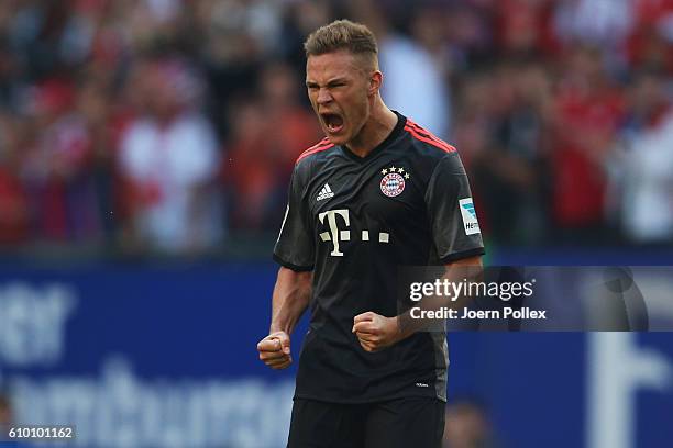 Joshua Kimmich of Muenchen celebrates after scoring his team's winning goal during the Bundesliga match between Hamburger SV and Bayern Muenchen at...