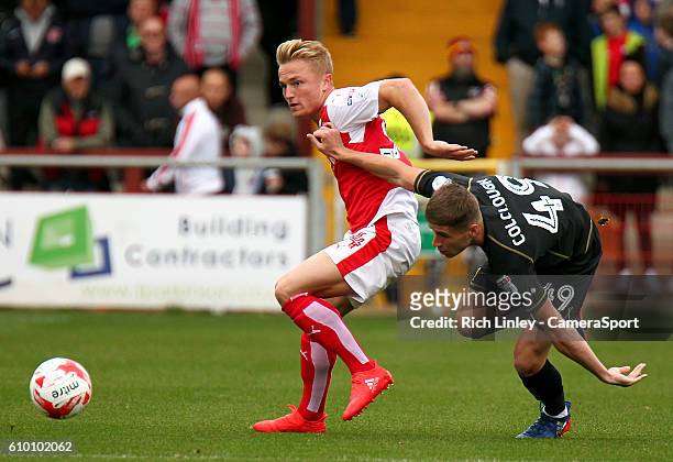 Fleetwood Town's Kyle Dempsey vies for possession with Milton Keynes Dons' Ryan Colclough during the Sky Bet League One match between Fleetwood Town...