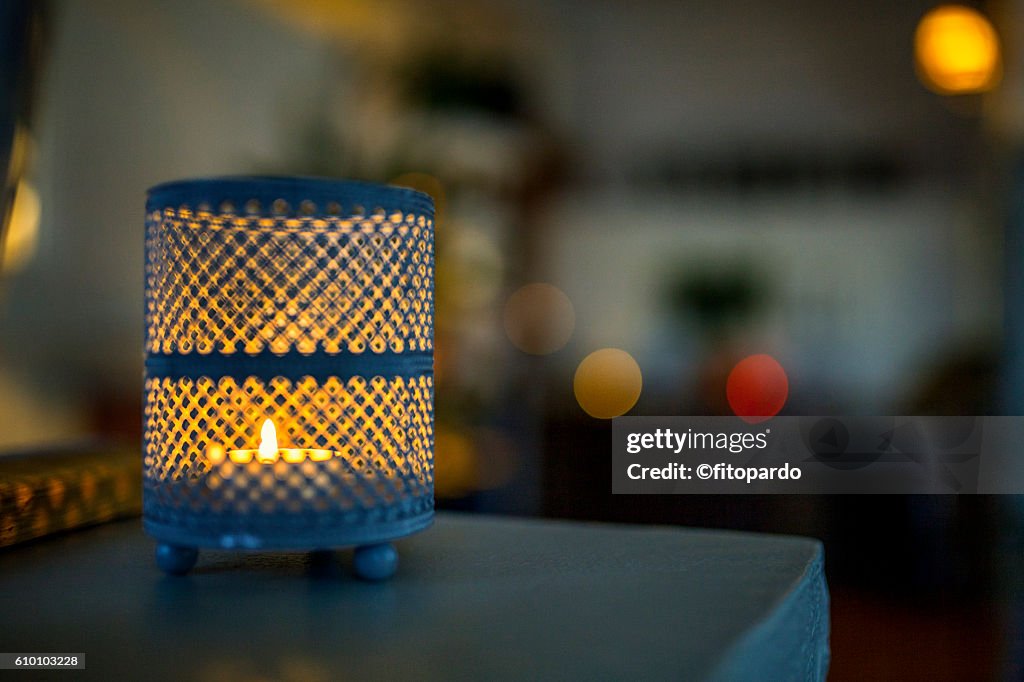 Beautiful Candle in a vase with bokeh