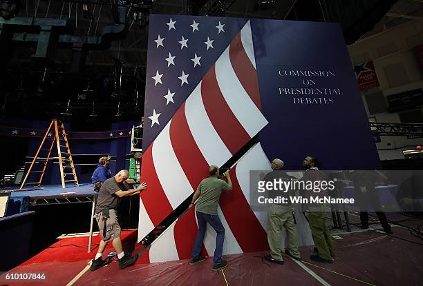 Workers install the set for the first U.S. Presidential debate at Hofstra University on September 24, 2016 in Hempstead, New York. Democratic...
