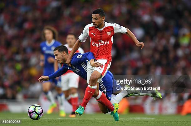 Eden Hazard of Chelsea is fouled by Francis Coquelin of Arsneal during the Premier League match between Arsenal and Chelsea at the Emirates Stadium...