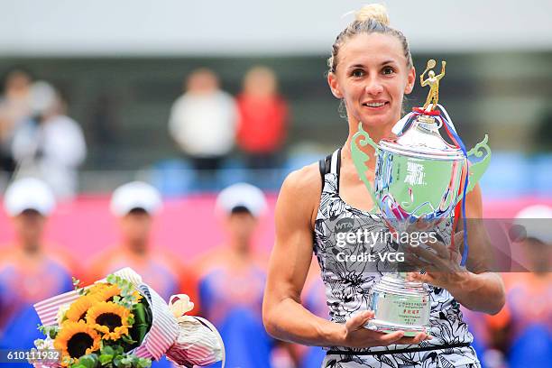 Lesia Tsurenko of Ukraine poses with trophy after winning in Women's Singles final during the 2016 WTA Guangzhou Open at Guangdong Olympic Tennis...
