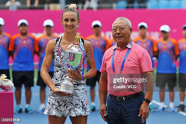 Lesia Tsurenko of Ukraine poses with trophy after winning in Women's Singles final during the 2016 WTA Guangzhou Open at Guangdong Olympic Tennis...