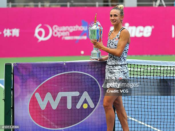 Lesia Tsurenko of Ukraine poses with trophy after winning in Women's Singles final during the 2016 WTA Guangzhou Open at Guangdong Olympic Tennis...