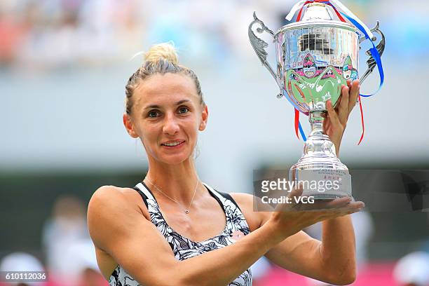 Lesia Tsurenko of Ukraine poses with trophy after winning in Women's Singles final during the 2016 WTA Guangzhou Open at Guangdong Olympic Tennis...