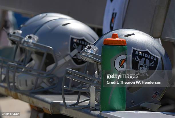 Detailed view of Oakland Raiders helmets sitting on the bench during the National Anthem prior to their game against the Atlanta Falcons at...