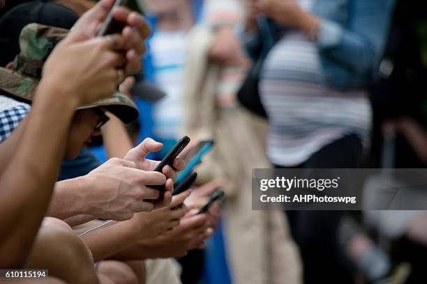 Man Using Many Phones Many Hands Holding Phones Photos and Premium High Res Pictures - Getty ...