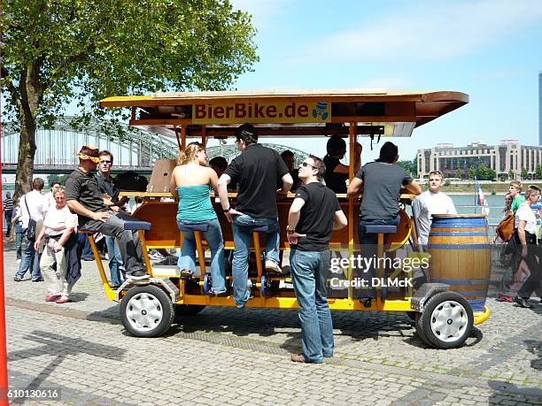 tourists riding a "bierbike" in germany, - drinking bier imagens e fotografias de stock