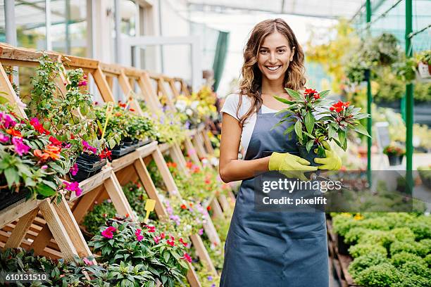 smiling young gardener - florist bildbanksfoton och bilder