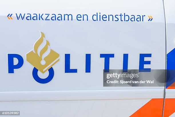 police - politie in dutch on side of police car - politie nederland stock pictures, royalty-free photos & images