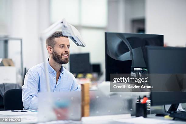 industrial designer working at computer in office - industrial designer stock pictures, royalty-free photos & images