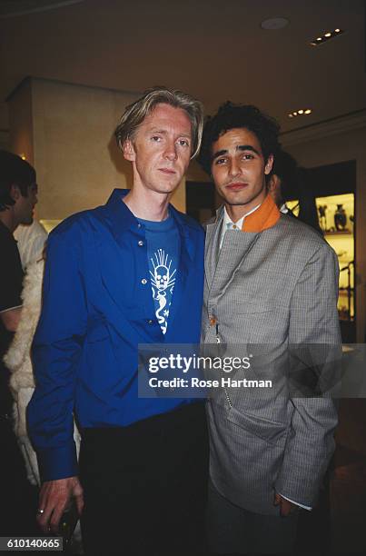 American fashion designer Zac Posen and Irish milliner Philip Treacy at the Prada Boutique, Bergdorf Goodman, New York City, circa 2000.