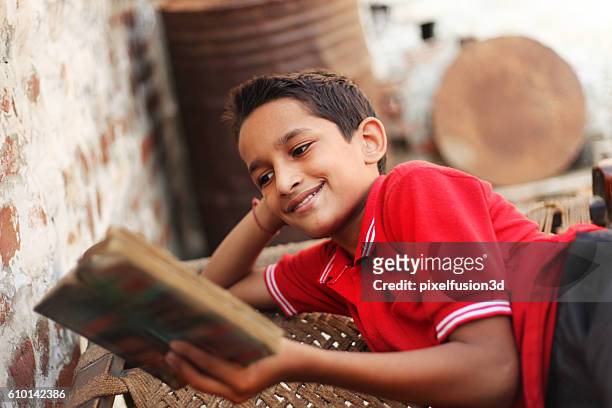 student reading a book - reading stock pictures, royalty-free photos & images