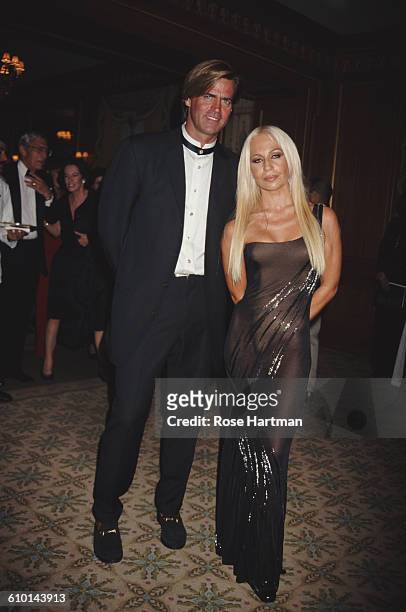 Italian fashion designer Donatella Versace and husband Paul Beck attend the 13th Annual Night of Stars at the Pierre Hotel, New York, New York, 1996.