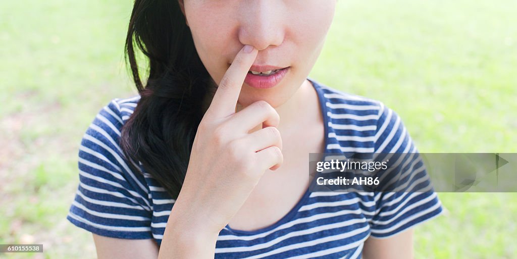 Woman feeling bad smell