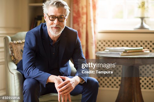 High class mature man portrait at home. High class mature man portrait at home.