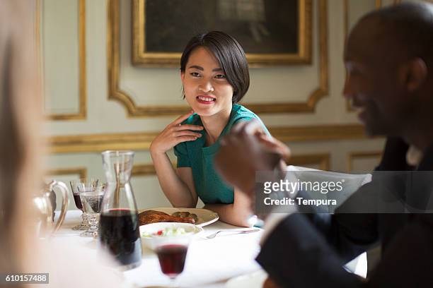 luxury dinner, friends eating together - premium paris stock pictures, royalty-free photos & images