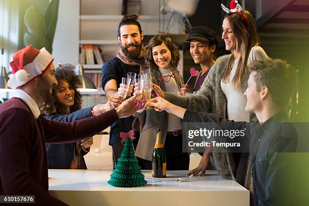 celebrating new year and christimas in the office. - christmas party office stockfoto's en -beelden