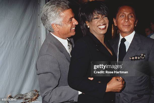 From left to right, Giancarlo Giammetti, Oprah Winfrey and Valentino at a Valentino fashion show at Bergdorf Goodman, New York City, 1996.