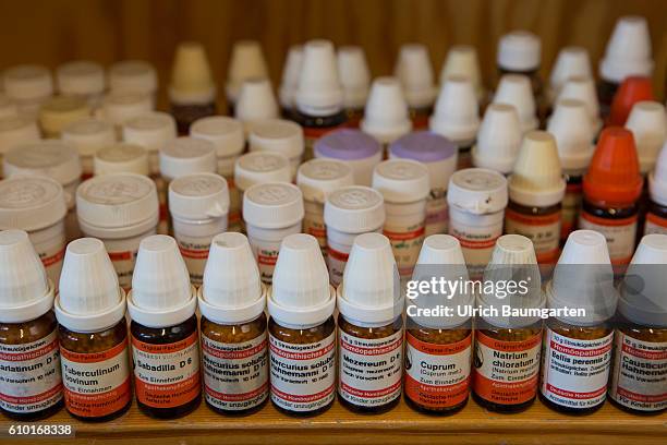 Homeopathy and natural therapies - when all else falls, the alternative practitioner is the last hope for many people. The photo shows bottles with...