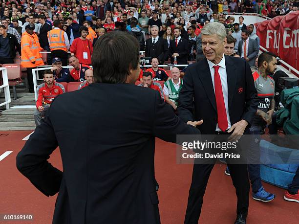Arsene Wenger the Manager of Arsenal shakes hands with Antonio Conte the Chelsea Manager before the Premier League match between Arsenal and Chelsea...