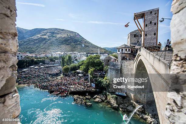In this handout image provided by Red Bull, David Colturi of the USA dives from the 27.5 metre platform on Stari Most during the seventh stop of the...