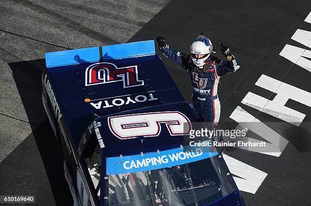 William Byron, driver of the Liberty University Toyota, celebrates after winning the NASCAR Camping World Truck Series UNOH 175 at New Hampshire...