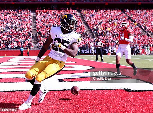 Akrum Wadley of the Iowa Hawkeyes scores the game winning touchdown against the Rutgers Scarlet Knights at High Point Solutions Stadium on September...