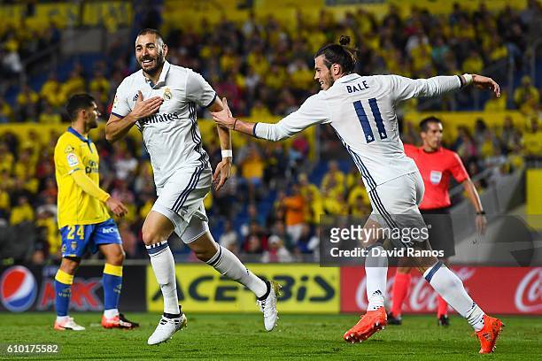 Karim Benzema celebrates with his team mate Gareth Bale after scoring his team's second goal of Real Madrid CF during the La Liga match between UD...