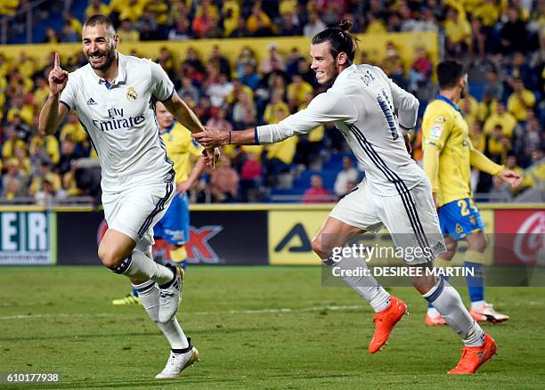 Real Madrid's French forward Karim Benzema celebrates his goal with Real Madrid's Welsh forward Gareth Bale during the Spanish league football match...