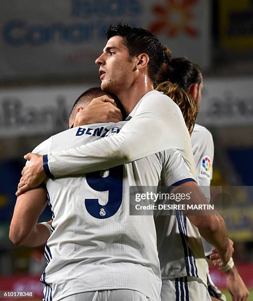 Real Madrid's French forward Karim Benzema celebrates his goal with Real Madrid's forward Alvaro Morata during the Spanish league football match UD...