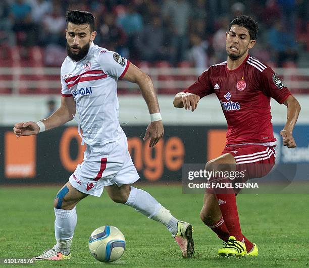 Zamalek Sporting Club's Hazem Mohammed Abdehamid Emam vies with Wydad Athletic Club's Amine Atouchi during the CAF Champions League semi-final...