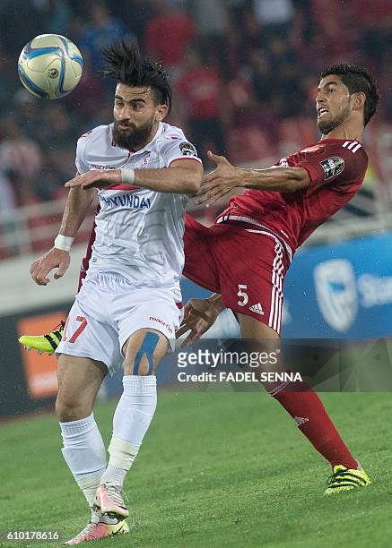 Zamalek Sporting Club's Hazem Mohammed Abdehamid Emam vies with the Wydad Athletic Club's Amine Atouchi during the CAF Champions League semi-final...
