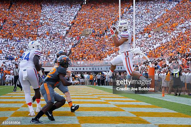 DeAndre Goolsby of the Florida Gators makes a three-yard touchdown reception against the Tennessee Volunteers in the first quarter at Neyland Stadium...