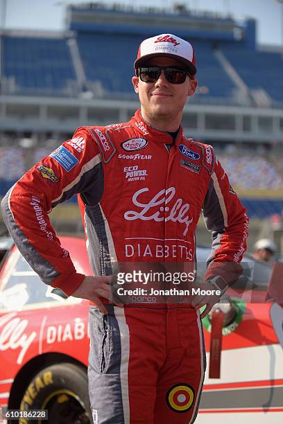 Ryan Reed, driver of the Lilly Diabetes / American Diabetes Association Ford Mustang Ford, stands next to his car before qualifying for the NACAR...