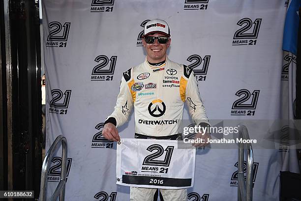 Erik Jones, driver of the GameStop Toyota, poses with the pole award after qualifying for the NACAR XFINITY Series VisitMyrtleBeach.com 300 at...