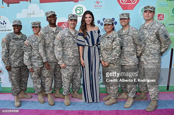 Actress Ali Landry poses with members of the U.S. Army National Guard at the Step2 & Favored.by Present The 5th Annual Red Carpet Safety Awareness...