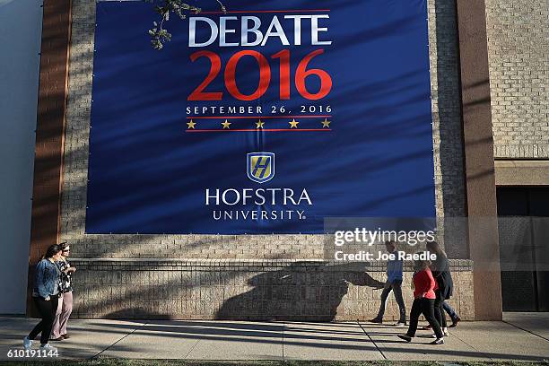 Debate sign hangs on a wall outside the media center setup for the first U.S. Presidential debate at Hofstra University on September 24, 2016 in...