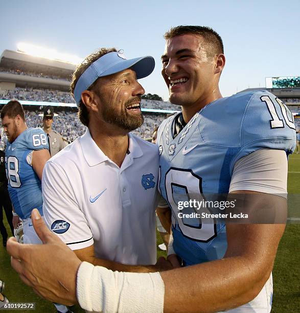 Head coach Larry Fedora of the North Carolina Tar Heels congratulates Mitch Trubisky of the North Carolina Tar Heels after defeating the Pittsburgh...