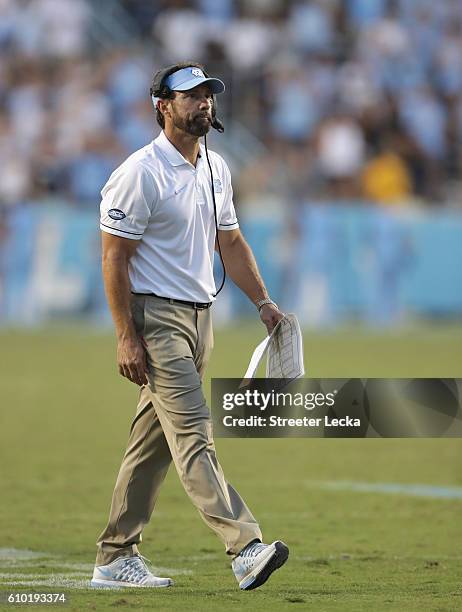 Head coach Larry Fedora of the North Carolina Tar Heels watches on against the Pittsburgh Panthers during their game at Kenan Stadium on September...
